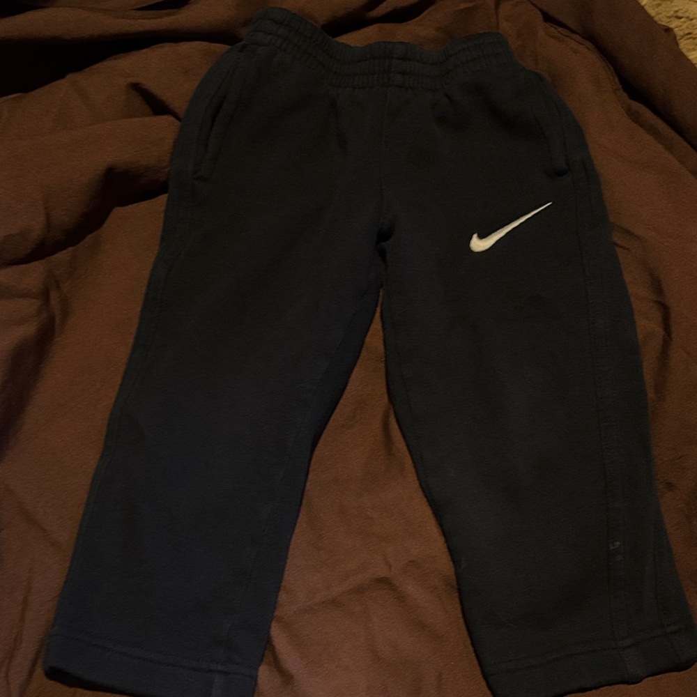 Nike Kids black Sweatpants with White Swoosh